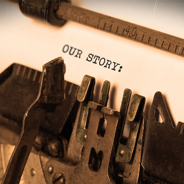 Vintage typewriter displaying the words Our Story
